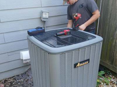 Engle Services HVAC Technician installing an AC unit in Talladega, Alabama