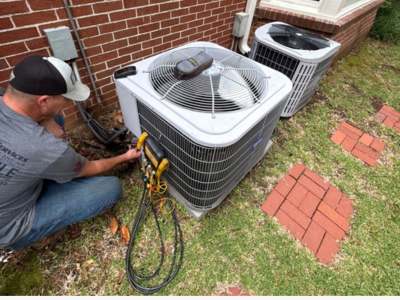 Engle Services HVAC Technician installing an AC unit in Pell City, Alabama